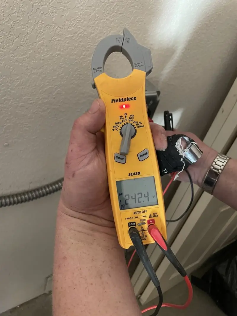 Voltage testing with clamp meter during Electrical Installation Services in Alachua